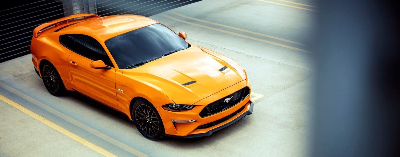 Orange 2018 Ford Mustang GT parked in a spot