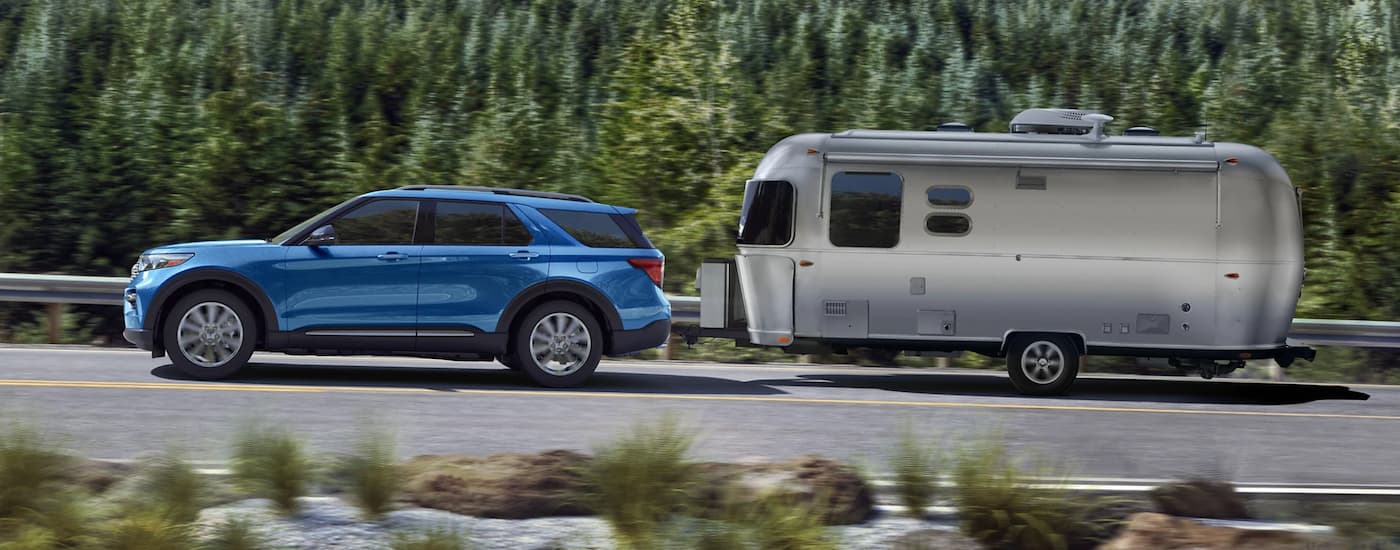 Blue 2021 Ford Explorer towing an Airstream