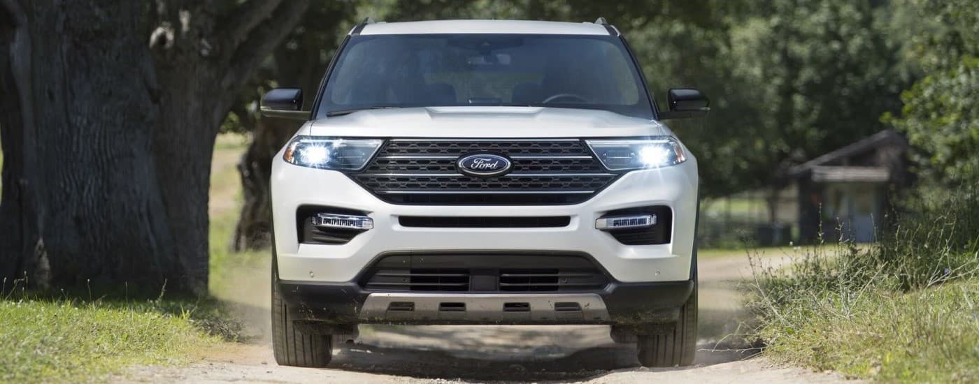 White 2023 Ford Explorer King Ranch driving down a trail