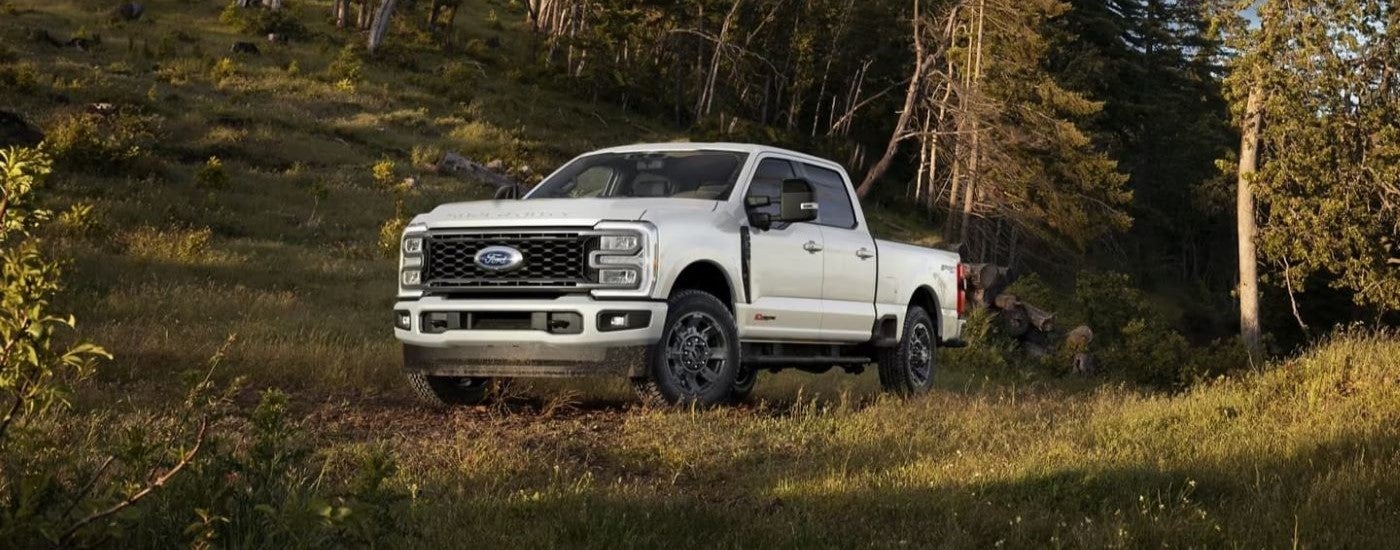 White 2024 Ford F-350 Lariat parked off-road