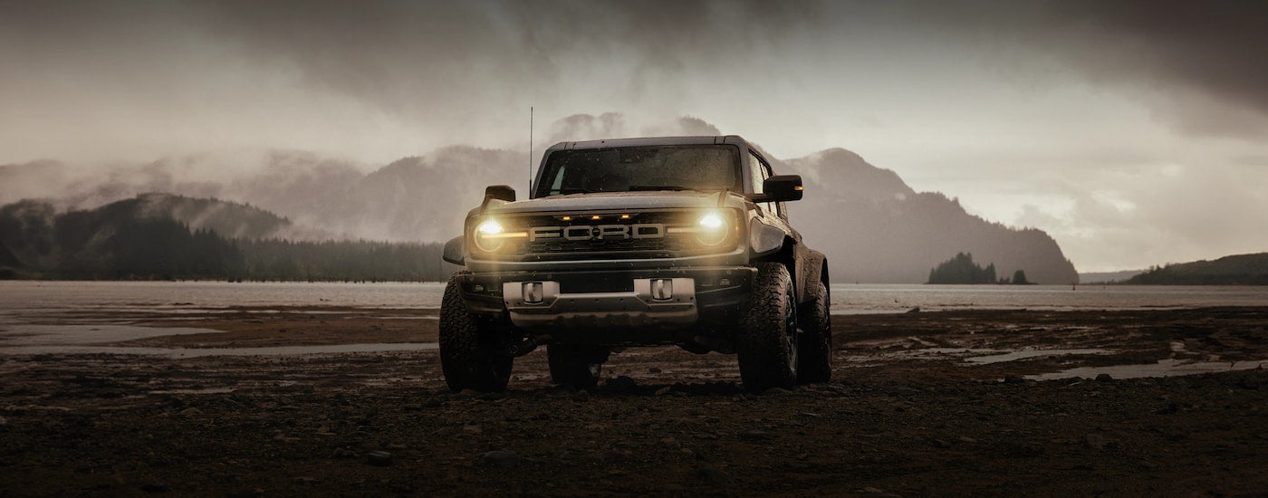 Brown 2025 Ford Bronco parked off-road.