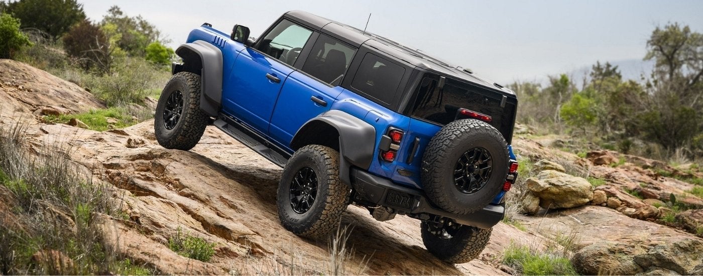 Blue 2025 Ford Bronco Raptor off-roading