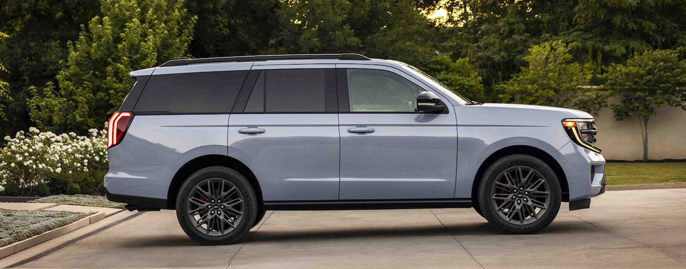 Side of a white 2025 Ford Expedition parked on a driveway.