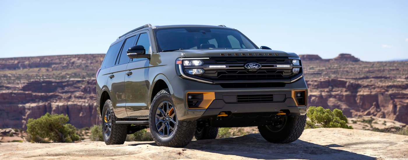 Green 2025 Ford Expedition Tremor parked off-road.