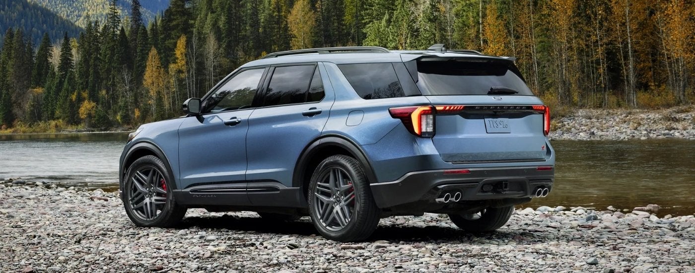 Blue 2026 Ford Explorer parked by a river