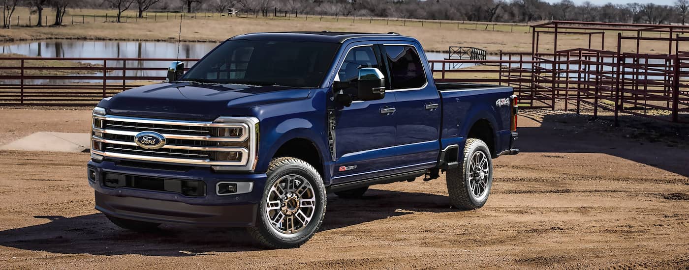 Dark blue 2026 Ford F-350 parked off-road.