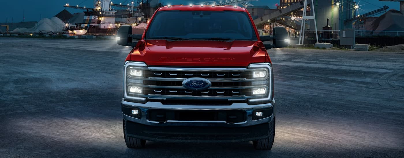 Front of a red 2026 Ford F-350 parked on asphalt.