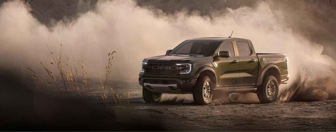 Black 2026 Ford Ranger drifting and kick up dust